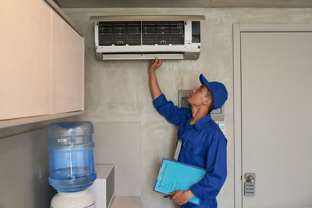 Technician performing AC Maintenance in New Braunfels, TX, on a AC unit. Technician performing AC Maintenance in New Braunfels, TX, on a AC unit.